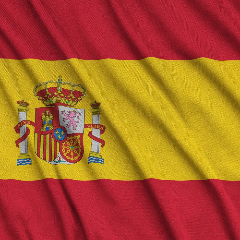 spain-flag-is-depicted-on-a-sports-cloth-fabric-with-many-folds-sport-team-waving-banner.jpg